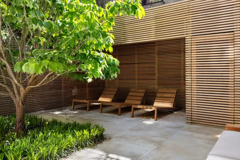 a backyard of a house with outdoor seating