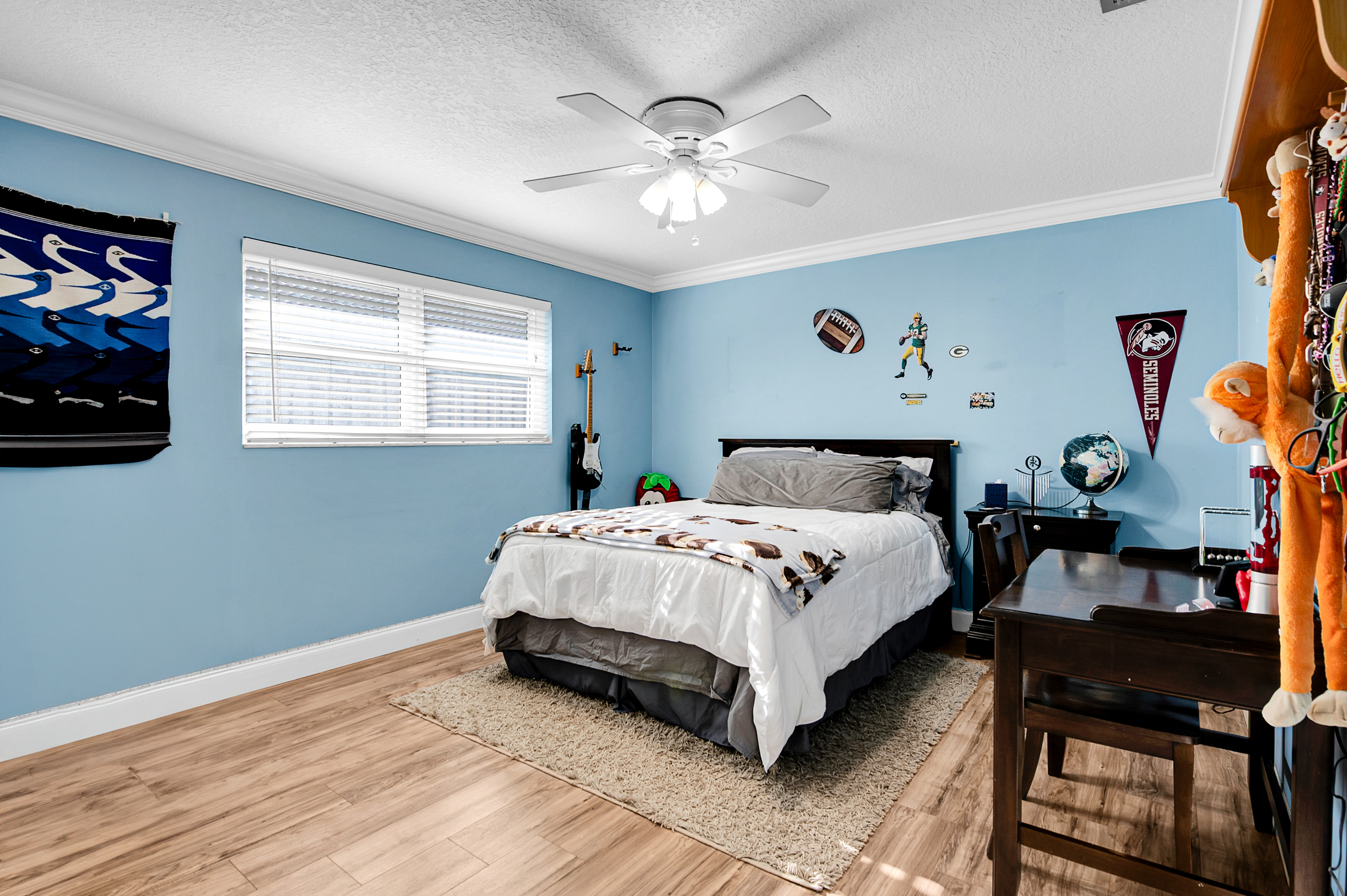 1560 Southwest 16th Street Boca Raton, FL 33486 - Photo 54 of 72 a spacious bedroom with a bed and a chandelier
