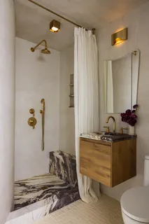 a view of a room with wooden floor and cabinet