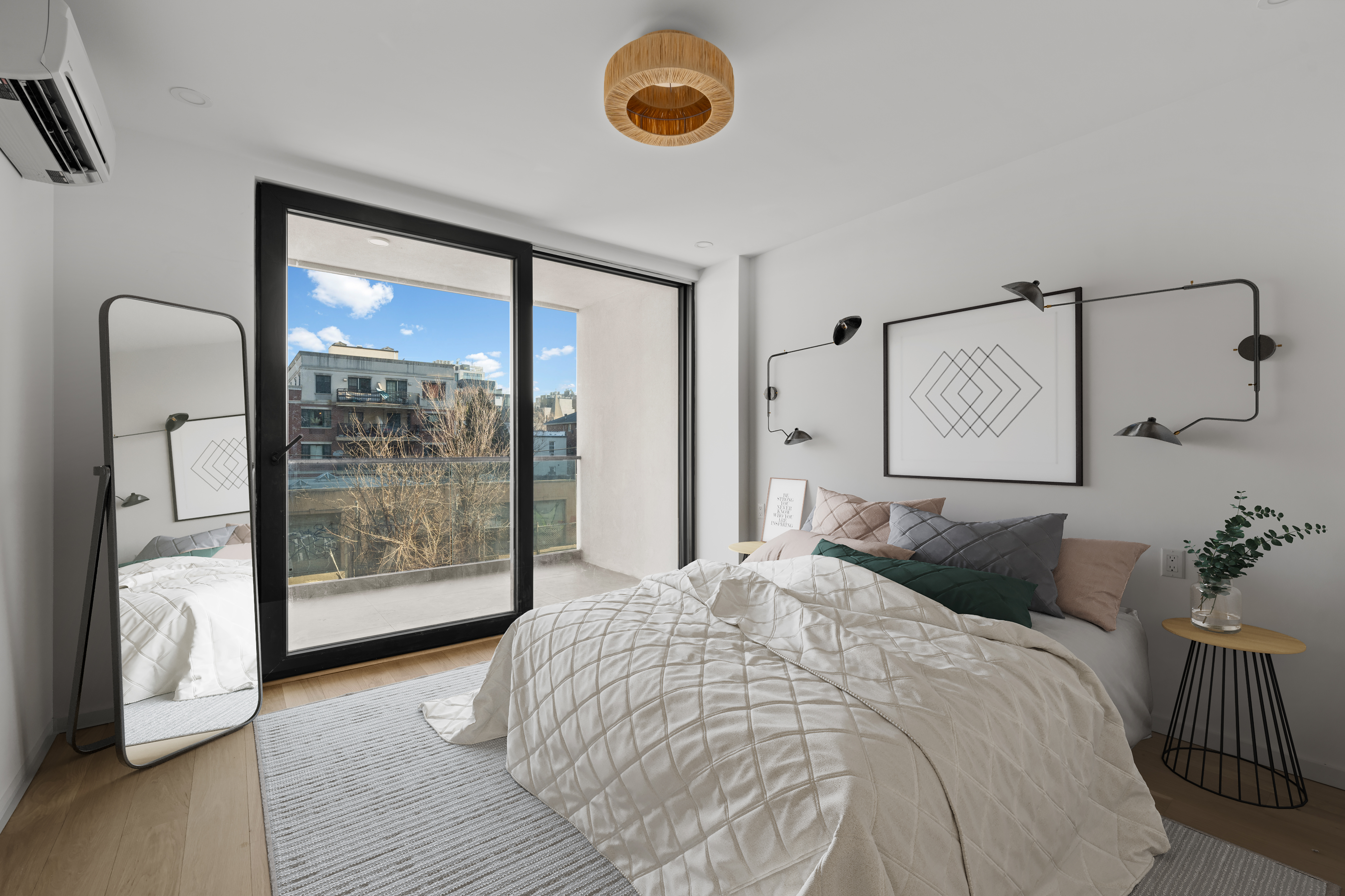 14-35 Broadway, Unit 1A Queens, NY 11106 - Photo 9 of 20 a bedroom with a bed and a window