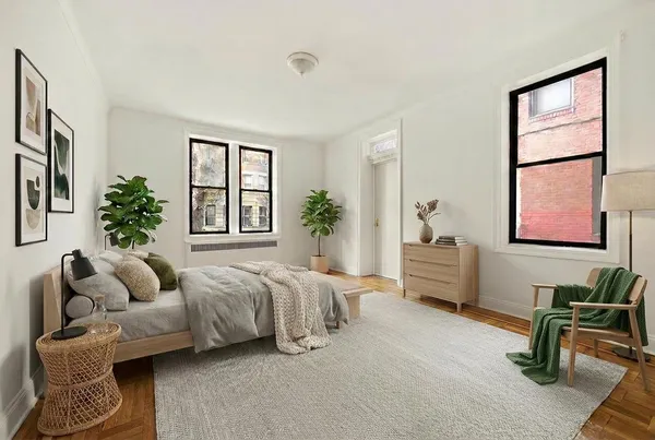 a bedroom with furniture and a window