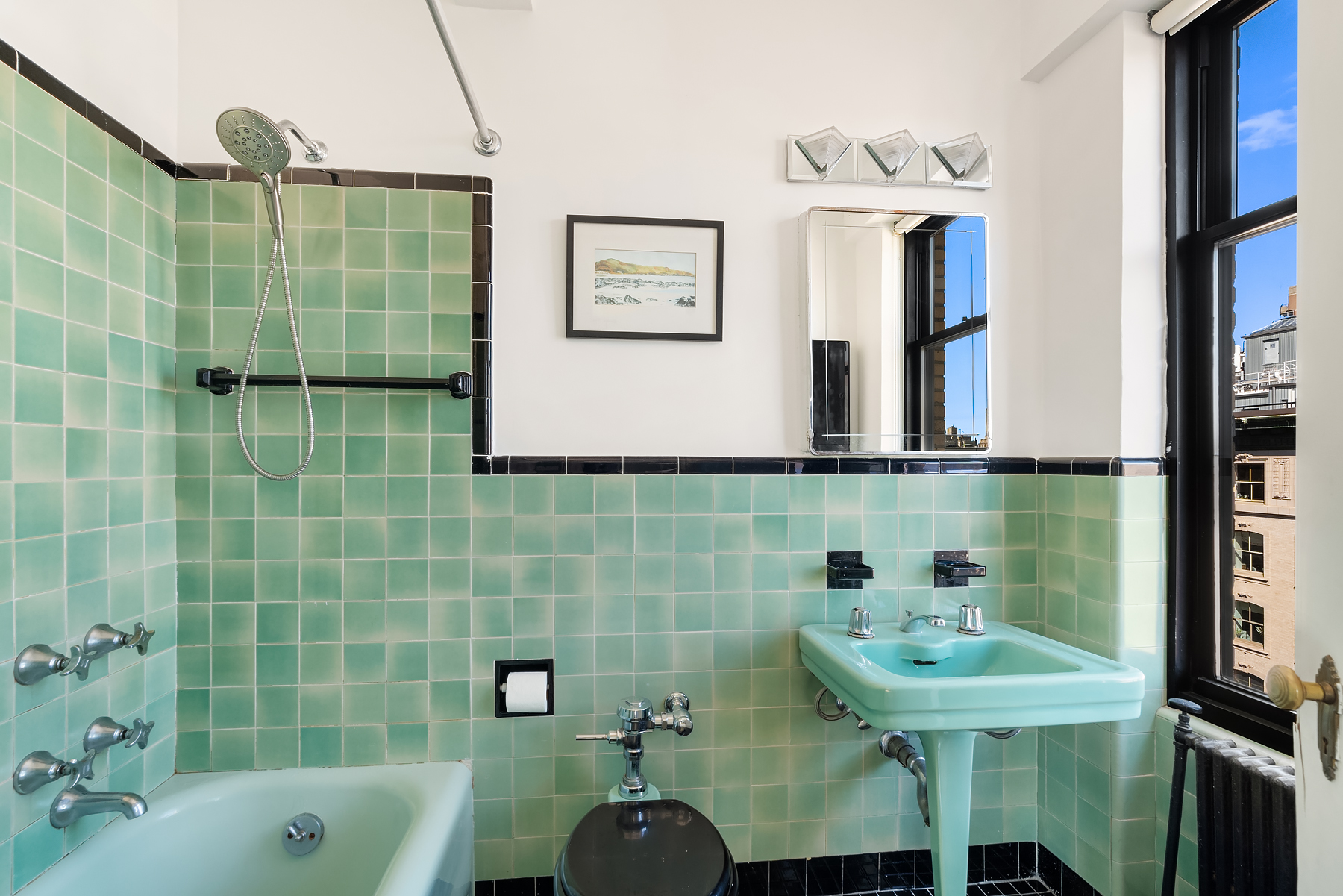 200 West 86th Street, Unit 17C Manhattan, NY 10024 - Photo 7 of 15 a bathroom with a sink a toilet and shower