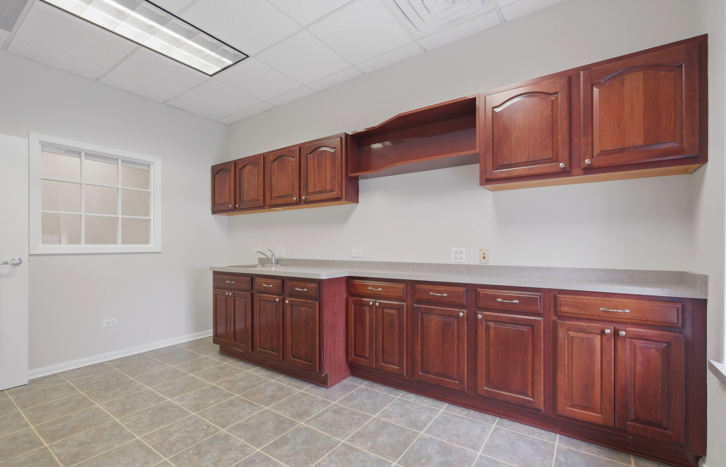 6475 Washington Street Gurnee, IL 60031 - Photo 7 of 45 a kitchen with stainless steel appliances granite countertop a sink dishwasher stove and cabinets