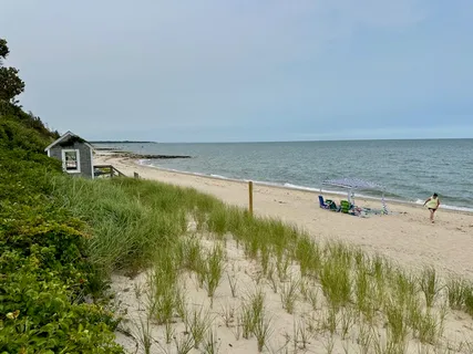 a view of a swimming pool and an outdoor seating