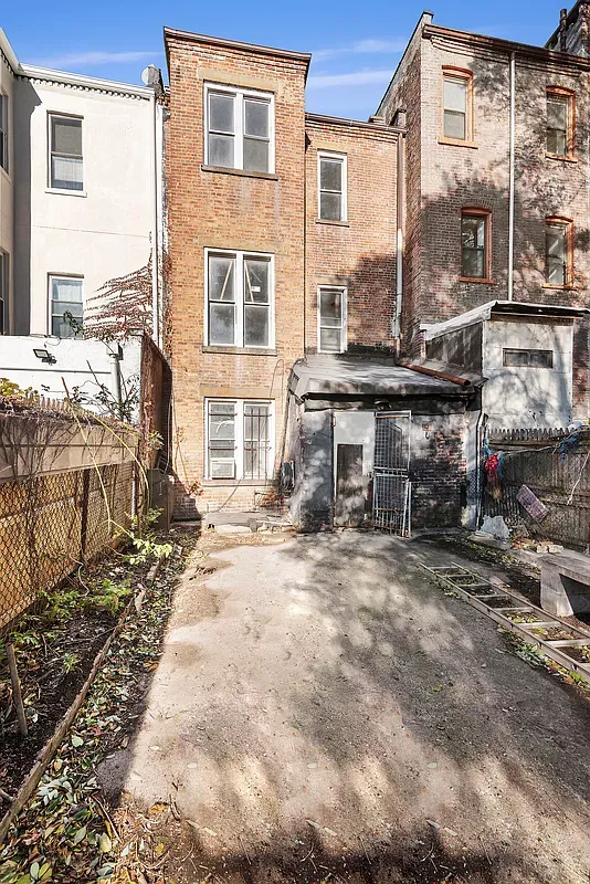 a front view of a house with many windows