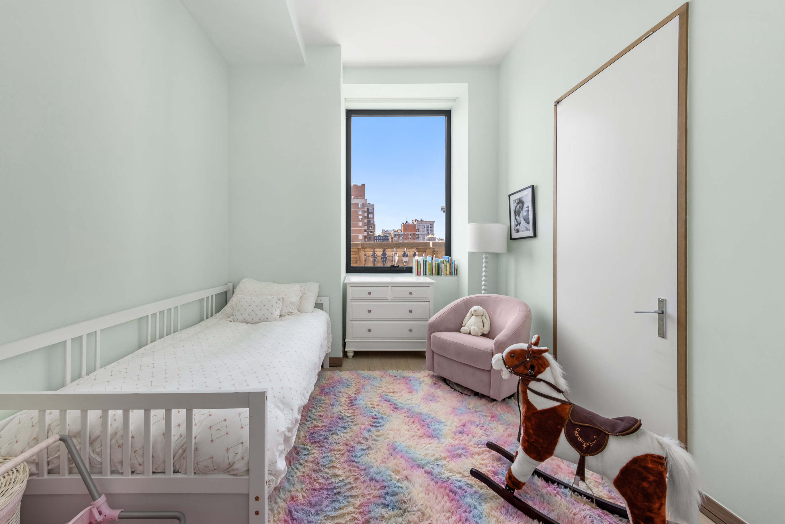 88 Lexington Avenue, Unit 1606 Manhattan, NY 10010 - Photo 14 of 20 a bedroom with furniture and a couch