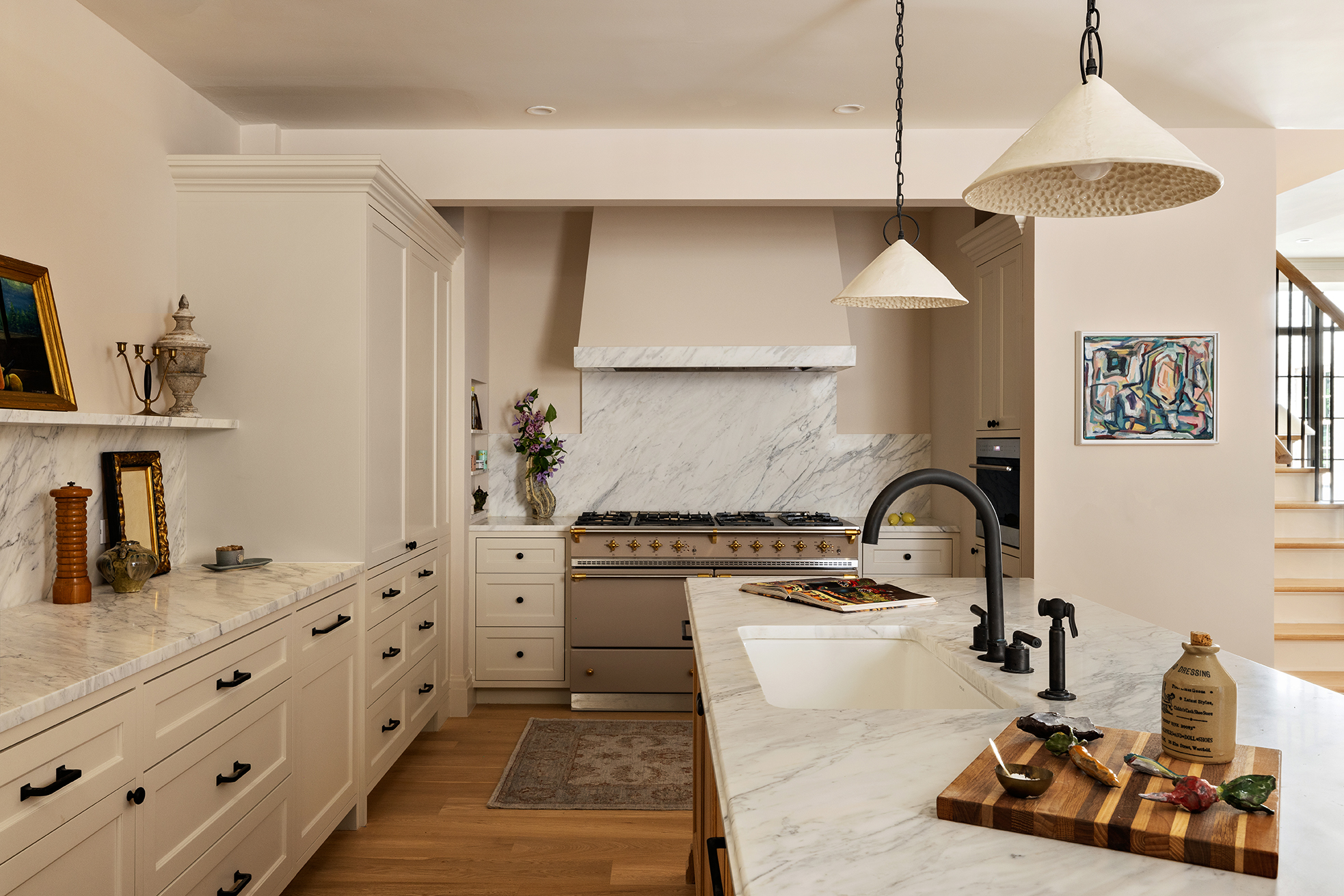 118 West 13th Street, Unit PH Manhattan, NY 10011 - Photo 13 of 31 a kitchen with granite countertop a stove a sink and a chandelier