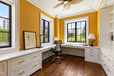 a room with a sink and a mirror