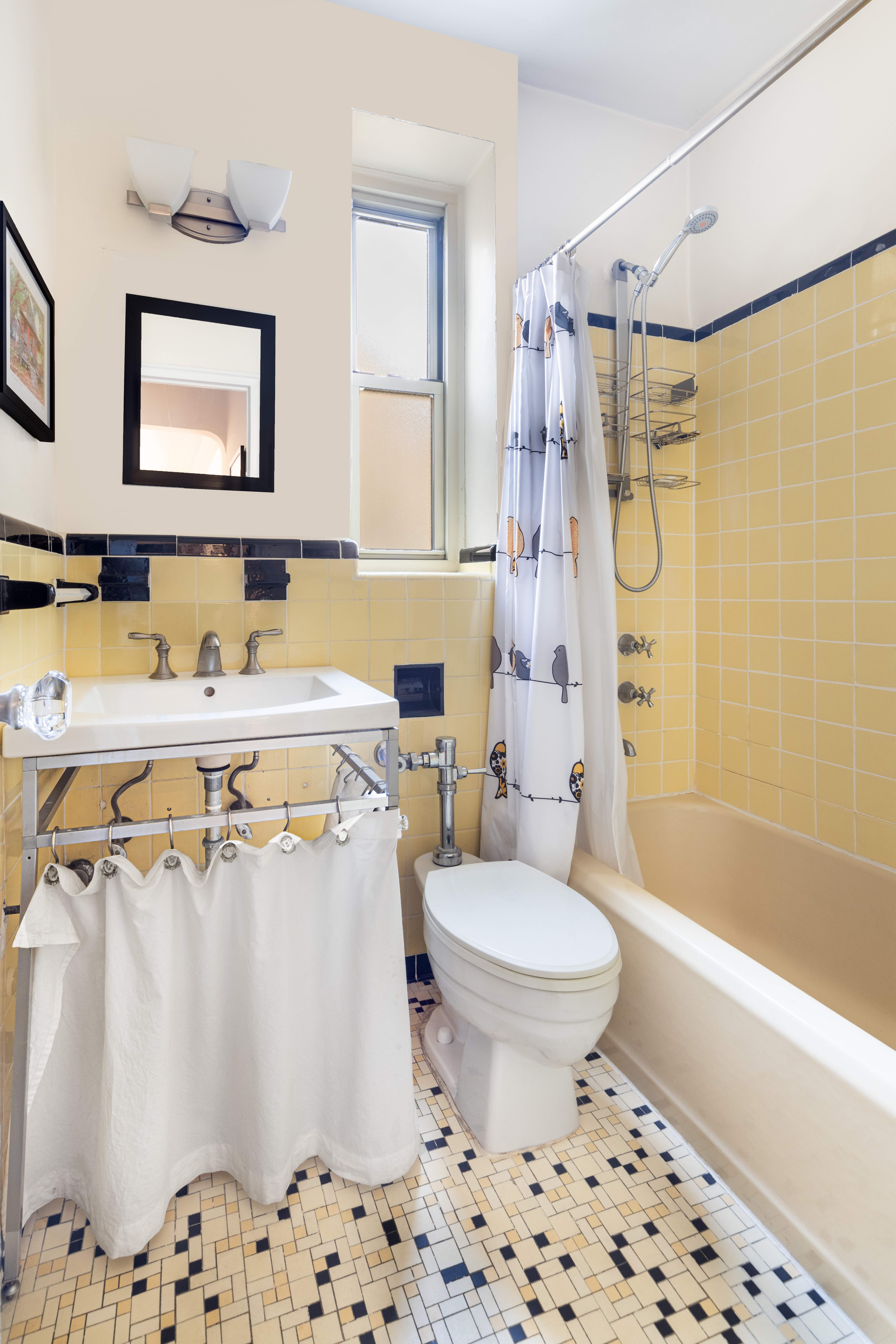 720 Fort Washington Avenue, Unit 6M Manhattan, NY 10040 - Photo 6 of 18 a bathroom with a sink toilet and shower