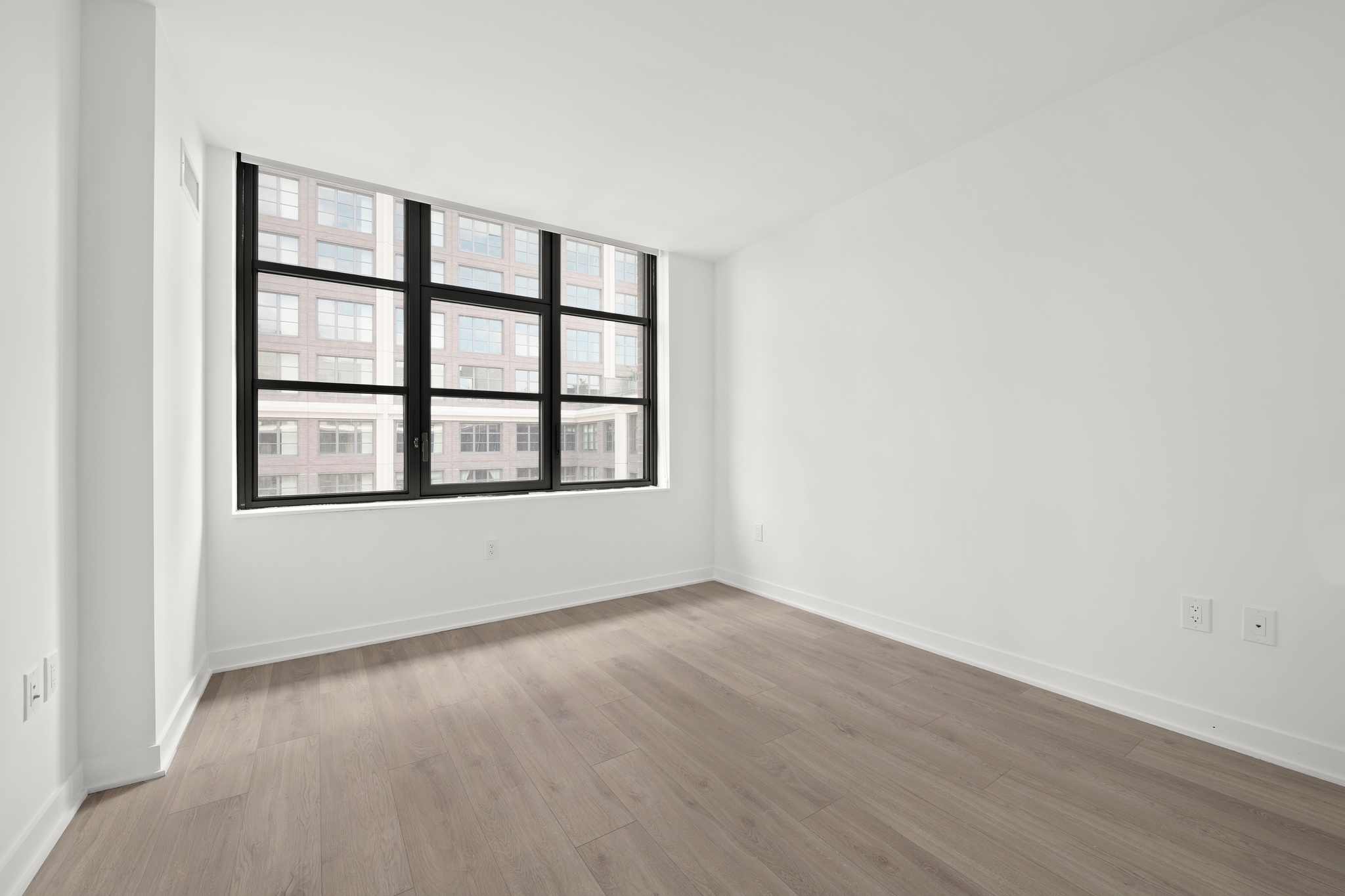 160 Front Street, Unit 706 Brooklyn, NY 11201 - Photo 13 of 17 a view of an empty room with a window