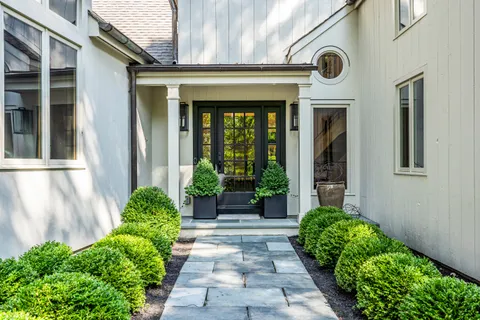 a front view of a house with garden