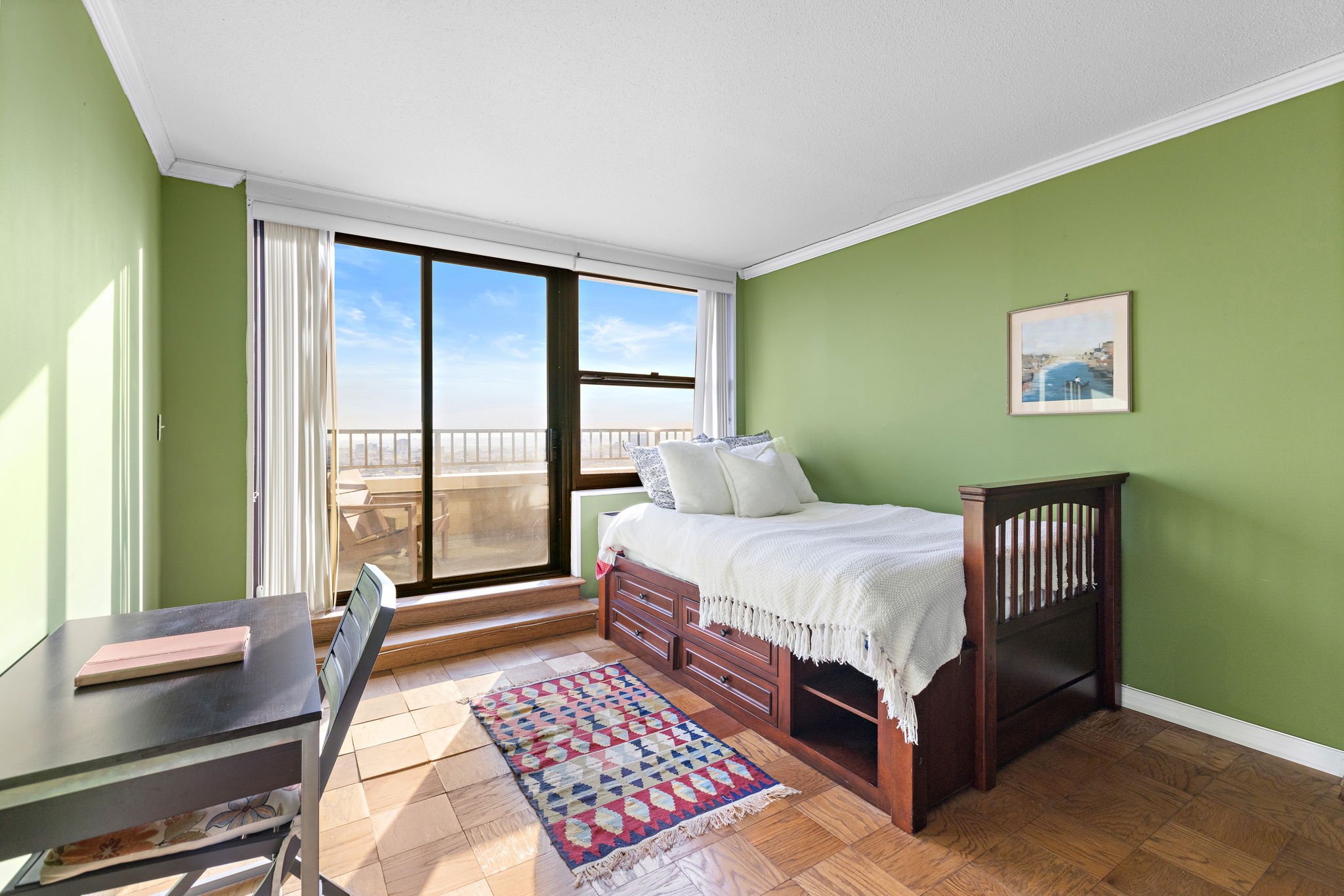 7004 JFK Boulevard East, Unit 40G Guttenberg, NJ 07093 - Photo 7 of 22 a bedroom with a bed wooden floor and a large window