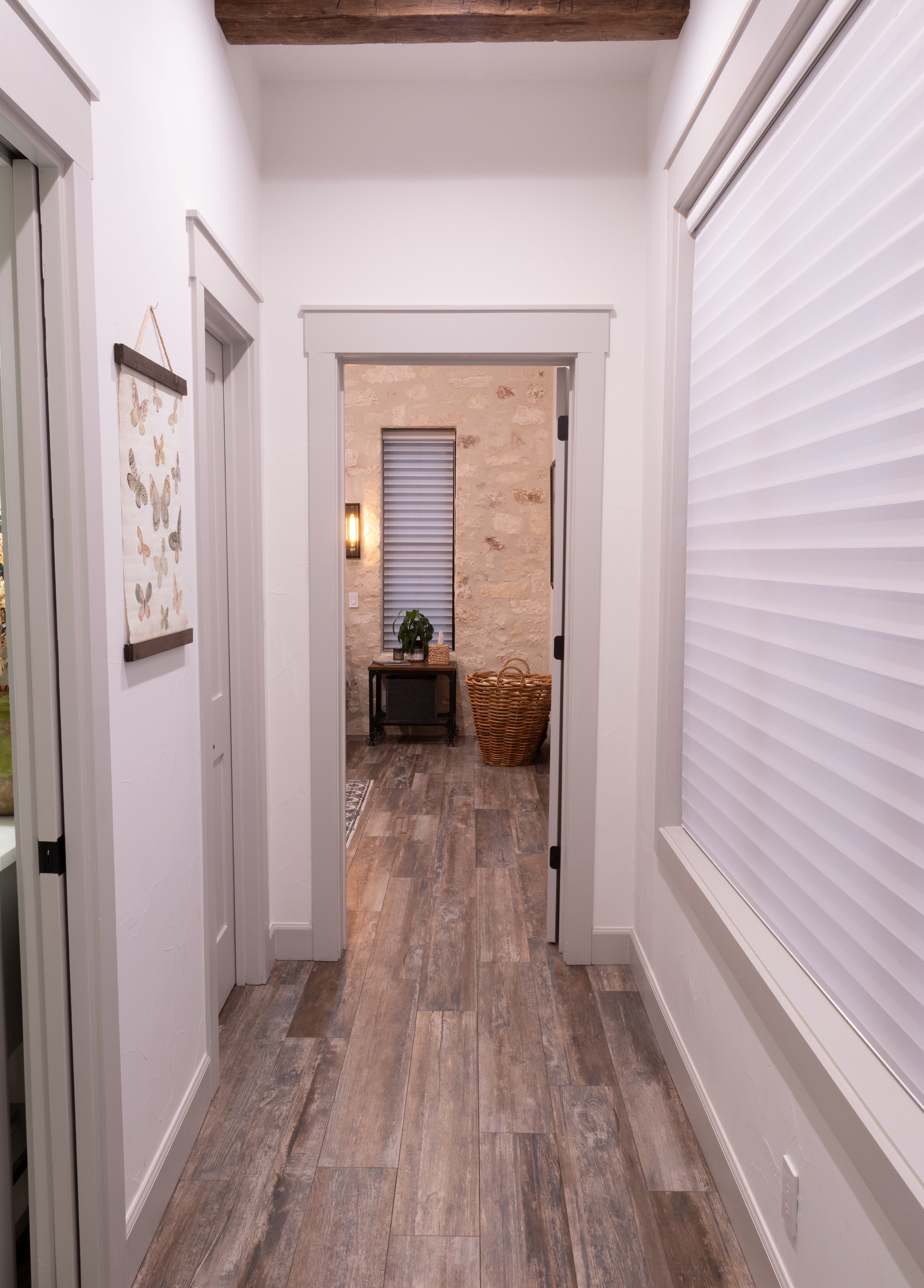 272 Slate Rock Road Willow City, TX 78675 - Photo 23 of 30 a view of a bedroom from a hallway
