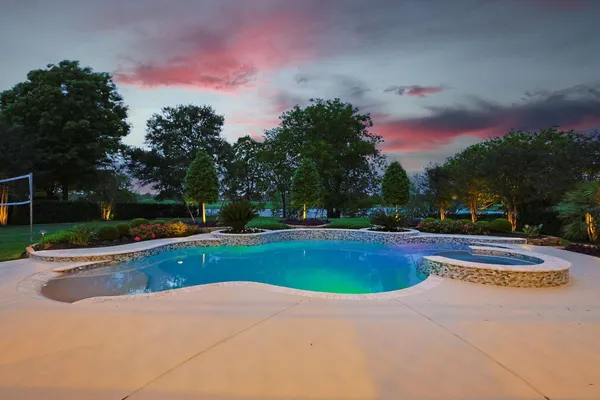 a view of a patio with couches table and chairs