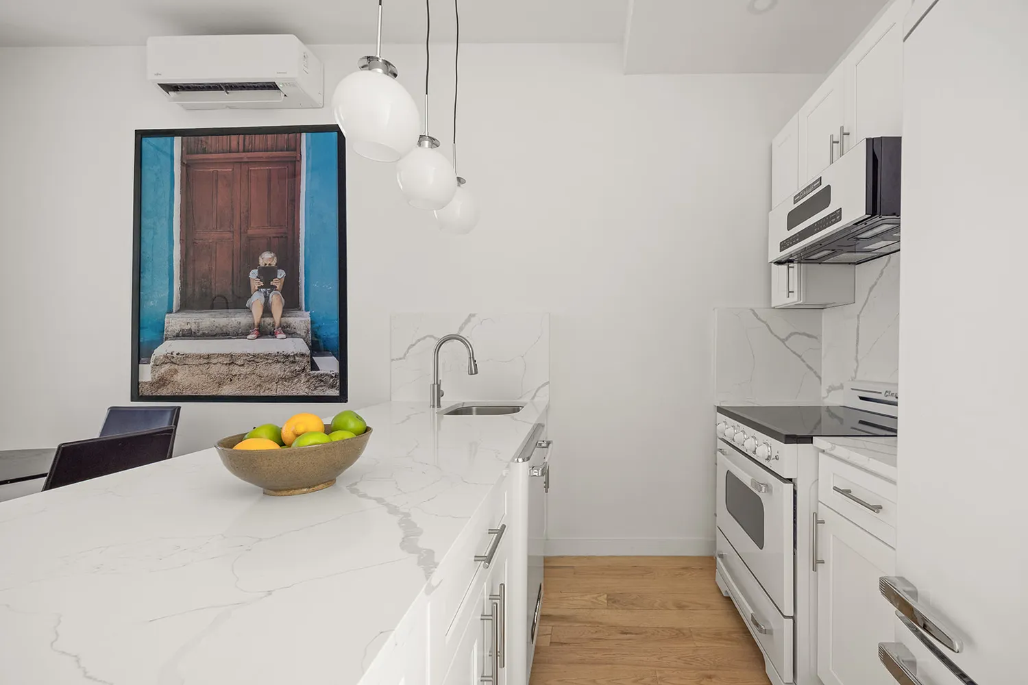 a kitchen with stainless steel appliances a sink stove and cabinets