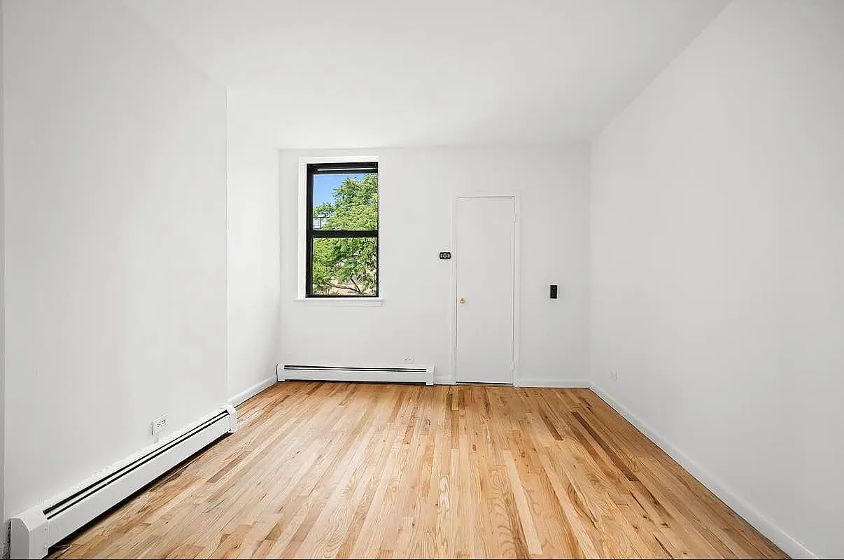 103 West 105th Street, Unit 5A Manhattan, NY 10025 - Photo 3 of 11 a view of a room with wooden floor and white walls