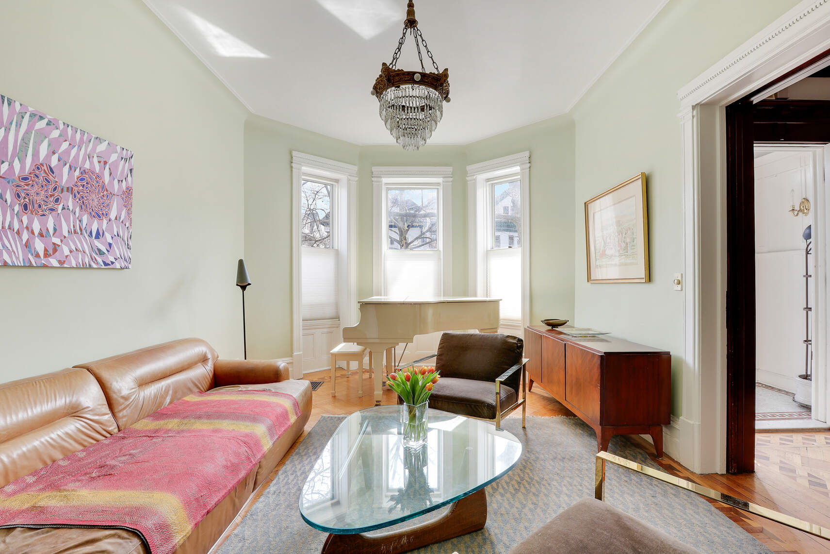 261 Fenimore Street Brooklyn, NY 11225 - Photo 7 of 21 a living room with furniture and a chandelier