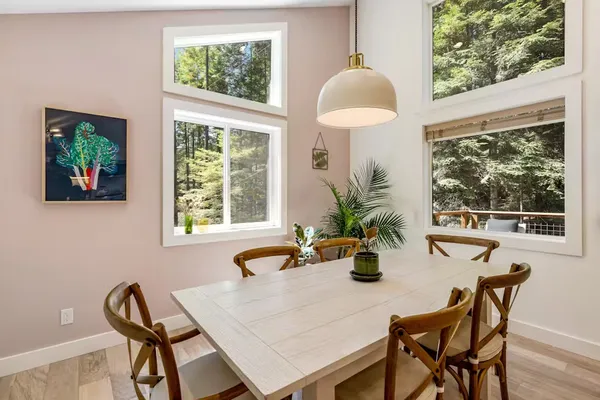 a dining room with furniture and window