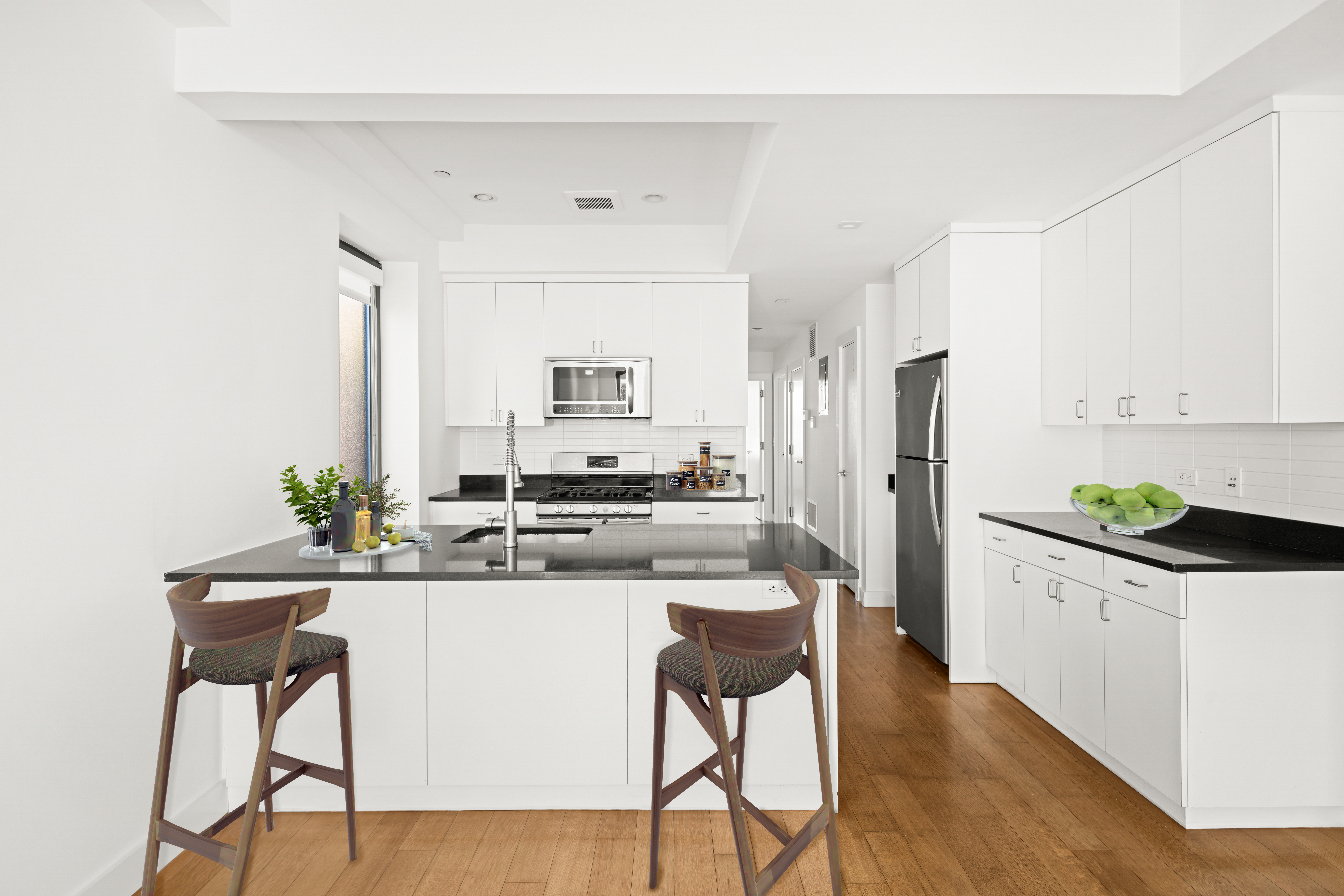 162 Beard Street Brooklyn, NY 11231 - Photo 8 of 20 a kitchen with stainless steel appliances a sink a stove a refrigerator cabinets and chairs