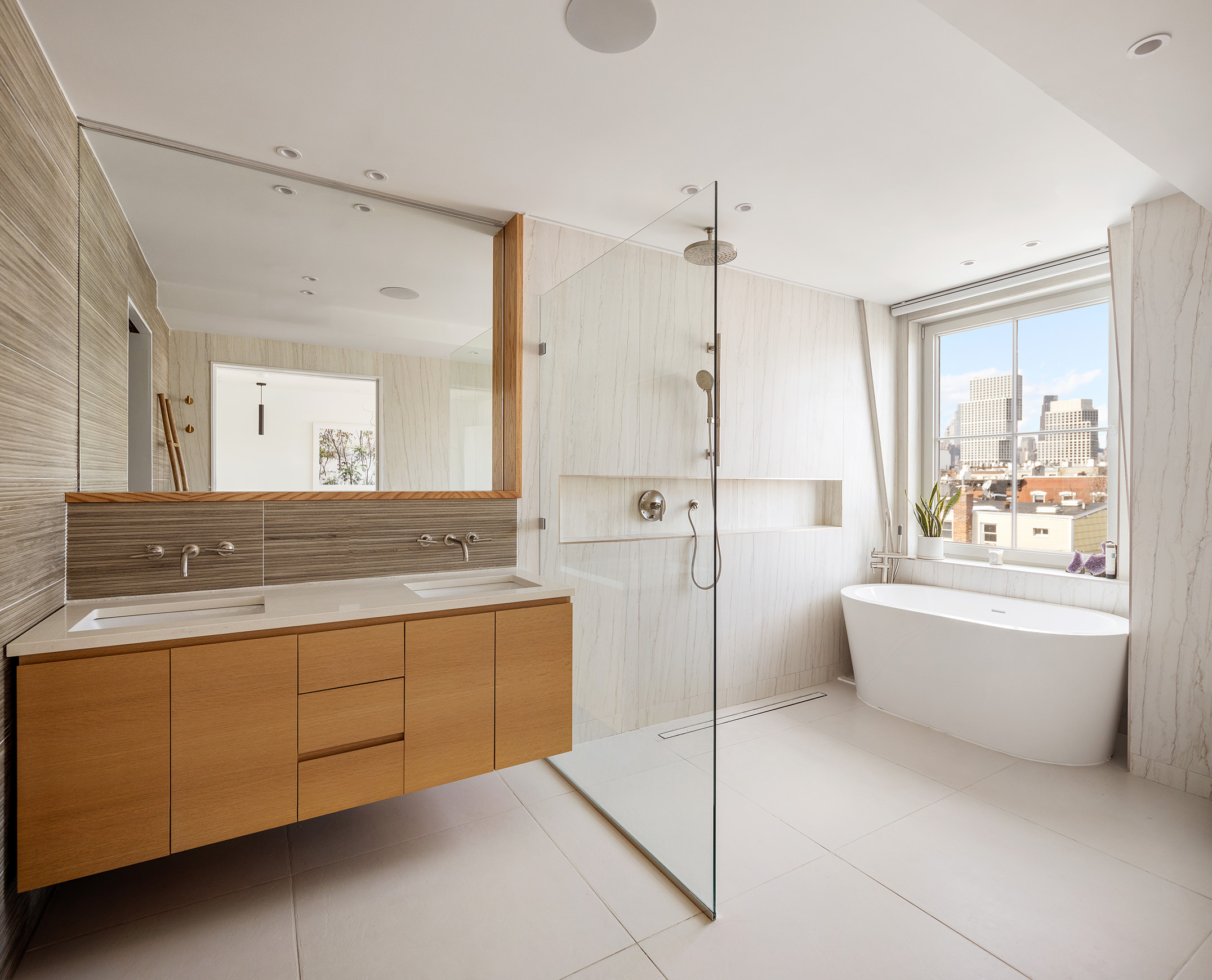 111 Noble Street, Unit 2 Brooklyn, NY 11222 - Photo 7 of 13 a spacious bathroom with a tub sink and mirror