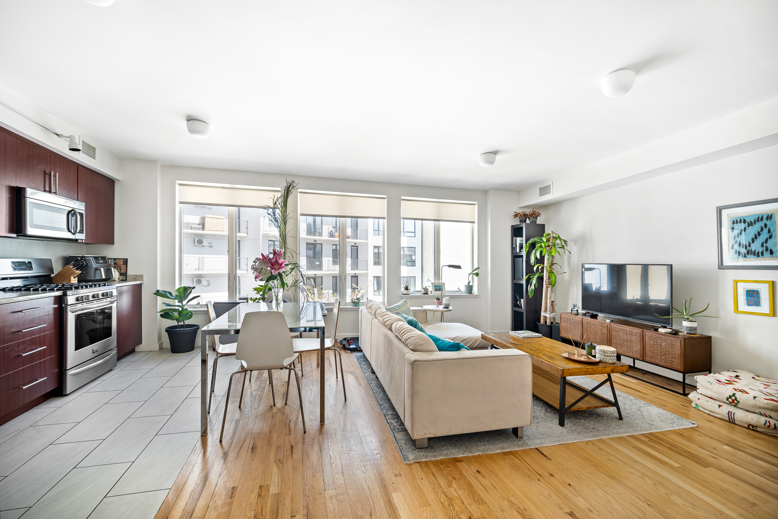 65 Jackson Street Brooklyn, NY 11211 - Photo 28 of 36 a living room with furniture wooden floor and a fireplace