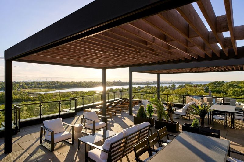 44-14 Douglaston Parkway, Unit 3B Queens, NY 11363 - Photo 9 of 12 a view of a balcony with chairs and ocean view