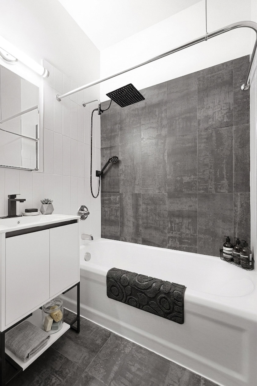 284 5th Avenue, Unit 6C Manhattan, NY 10001 - Photo 4 of 9 a bathroom with a tub a sink and a shower