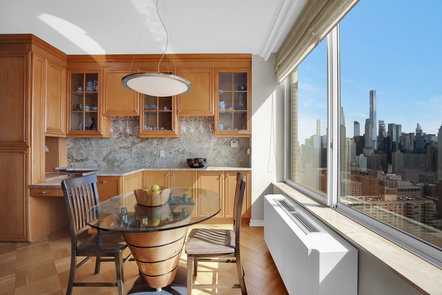 200 Riverside Boulevard, Unit 44A Manhattan, NY 10069 - Photo 7 of 22 a view of a dining room with furniture and chandelier