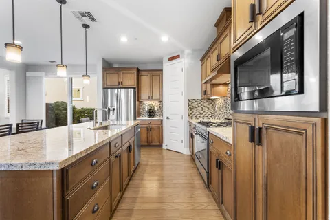 a bedroom with a bed and a view of kitchen