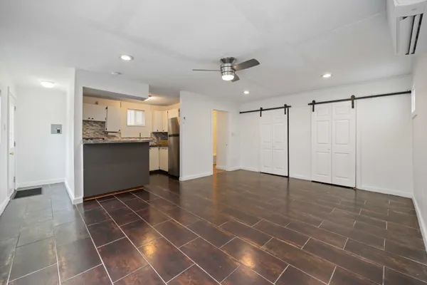 a view of a kitchen with a sink and cabinets