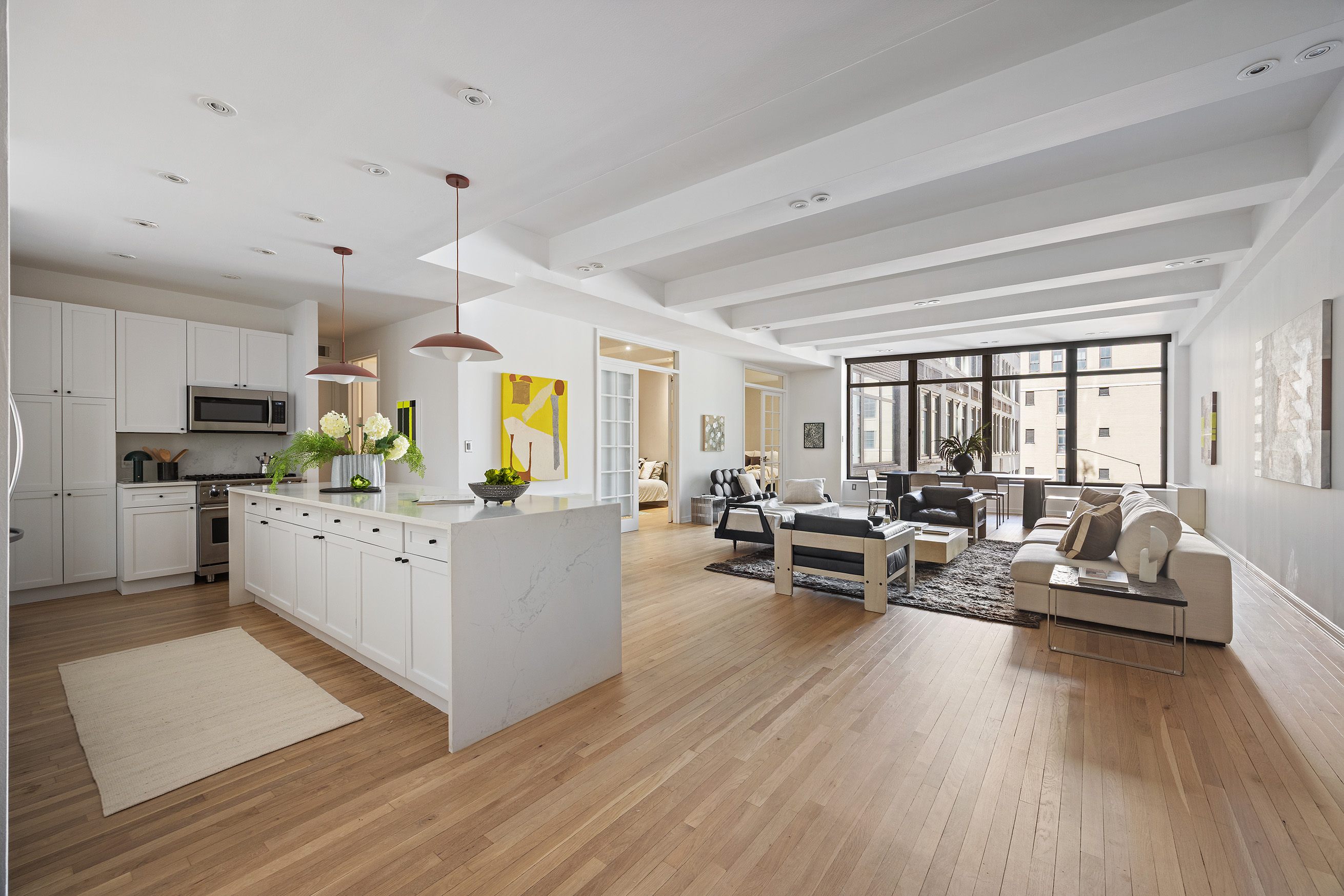 252 7th Avenue, Unit 9R Manhattan, NY 10001 - Photo 11 of 23 a living room with furniture and a wooden floor