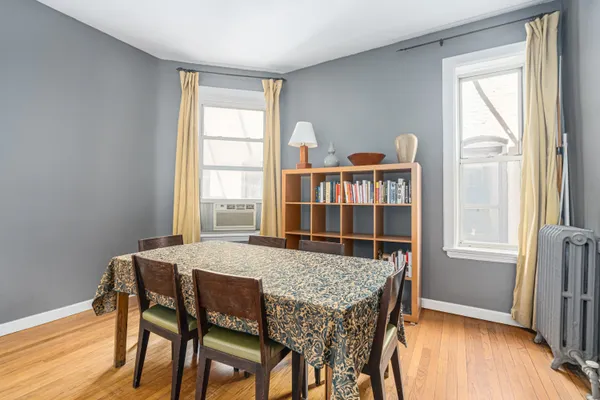 a dining room with furniture and window