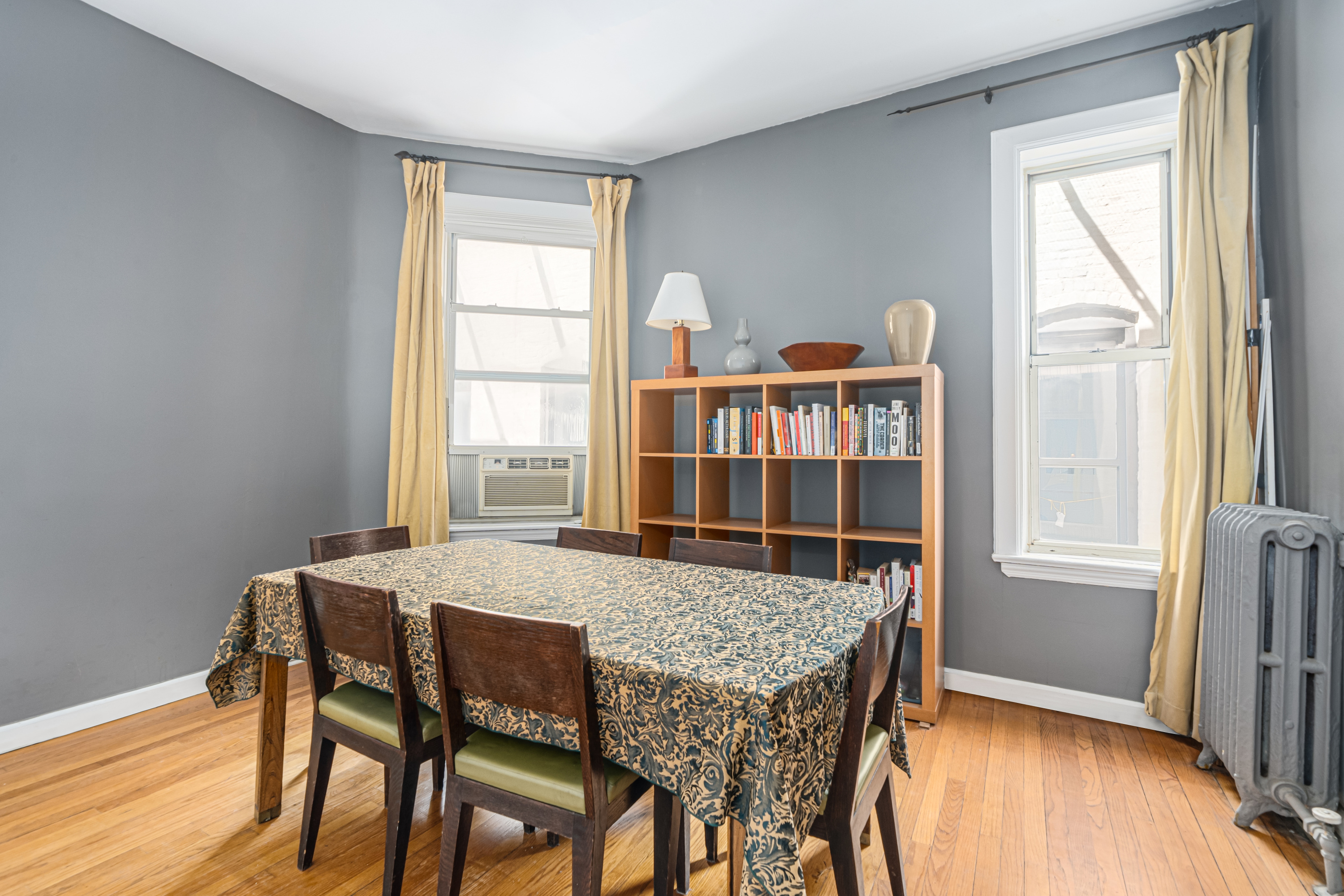 212 West 85th Street, Unit 5W Manhattan, NY 10024 - Photo 2 of 11 a dining room with furniture and window