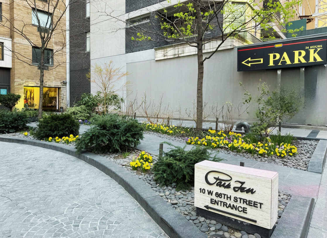 10 West 66th Street, Unit 7C Manhattan, NY 10023 - Photo 17 of 19 a view of a sign board with buildings in the background