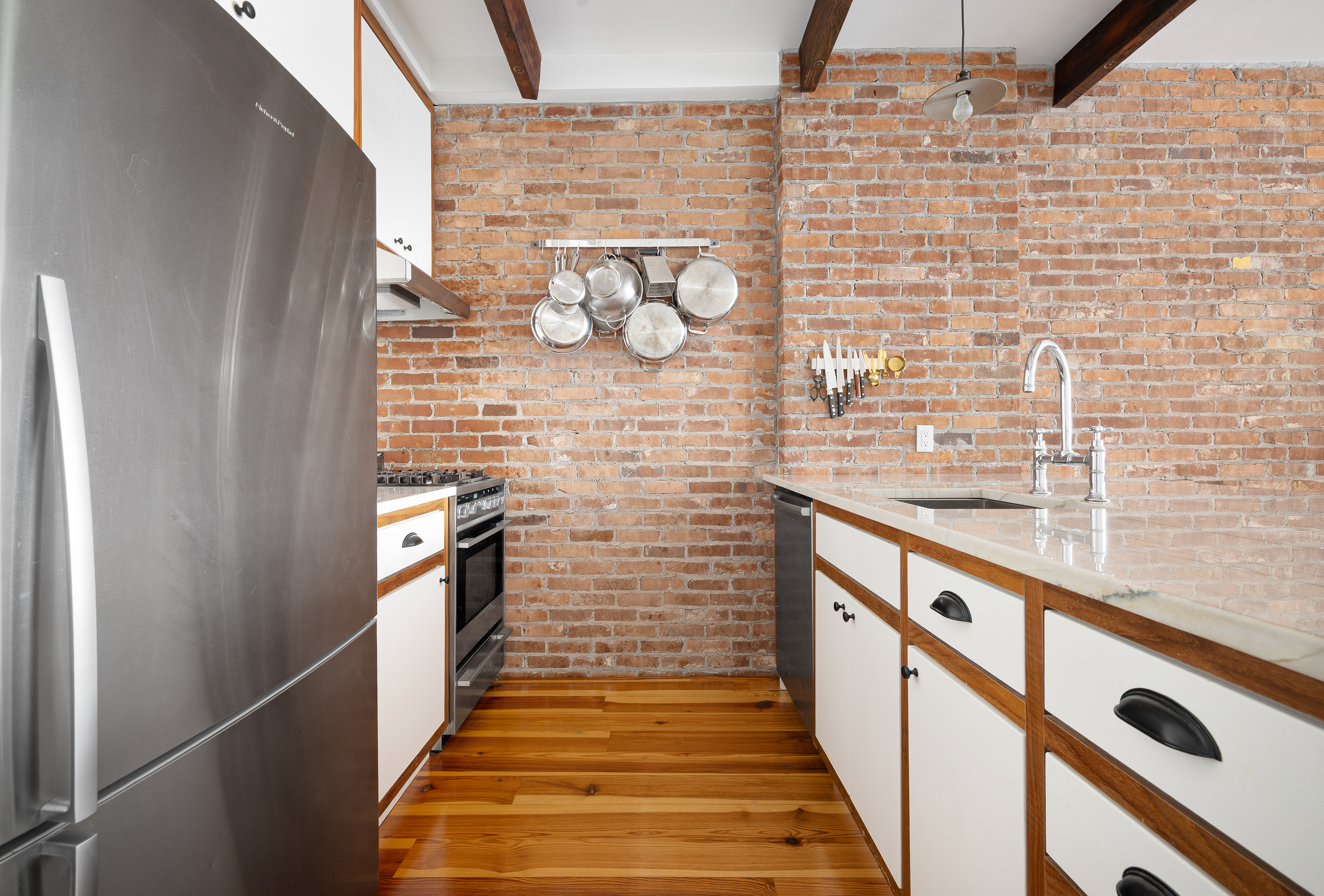 174 Jackson Street, Unit 2A Brooklyn, NY 11211 - Photo 8 of 17 a bathroom with a wooden floor and a shower