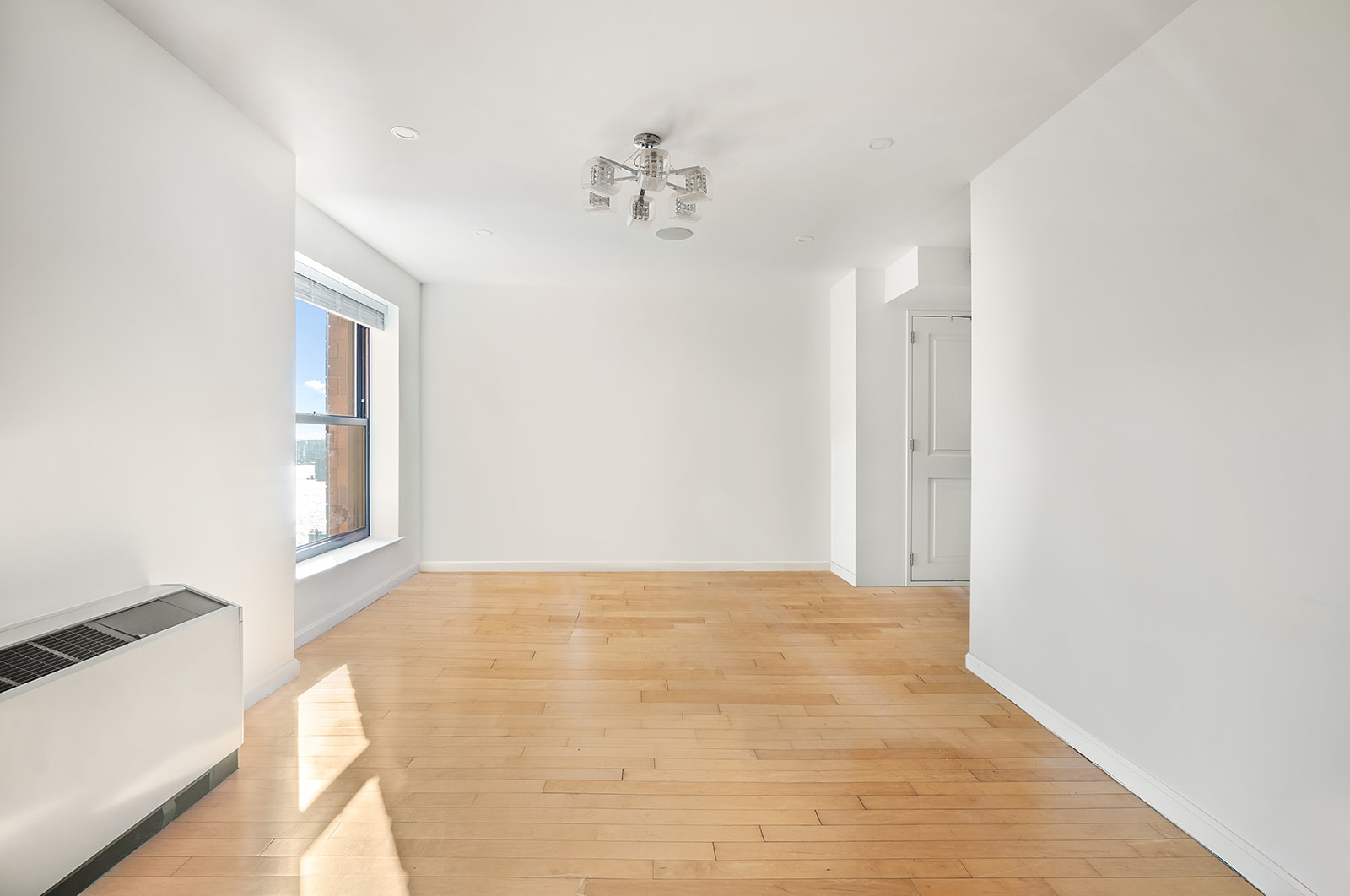 20 West Street, Unit 28F Manhattan, NY 10004 - Photo 2 of 18 a view of an empty room with a window