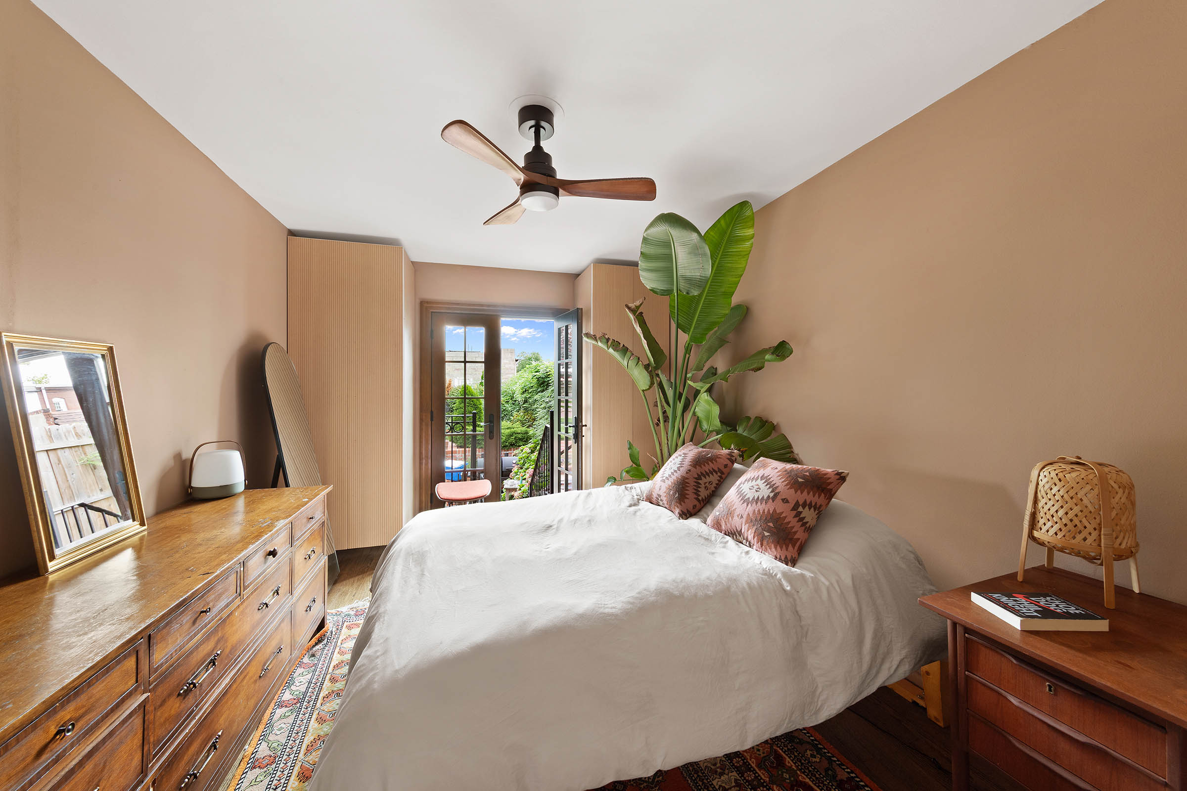 209 Onderdonk Avenue Queens, NY 11385 - Photo 7 of 16 a bedroom with a bed and a window