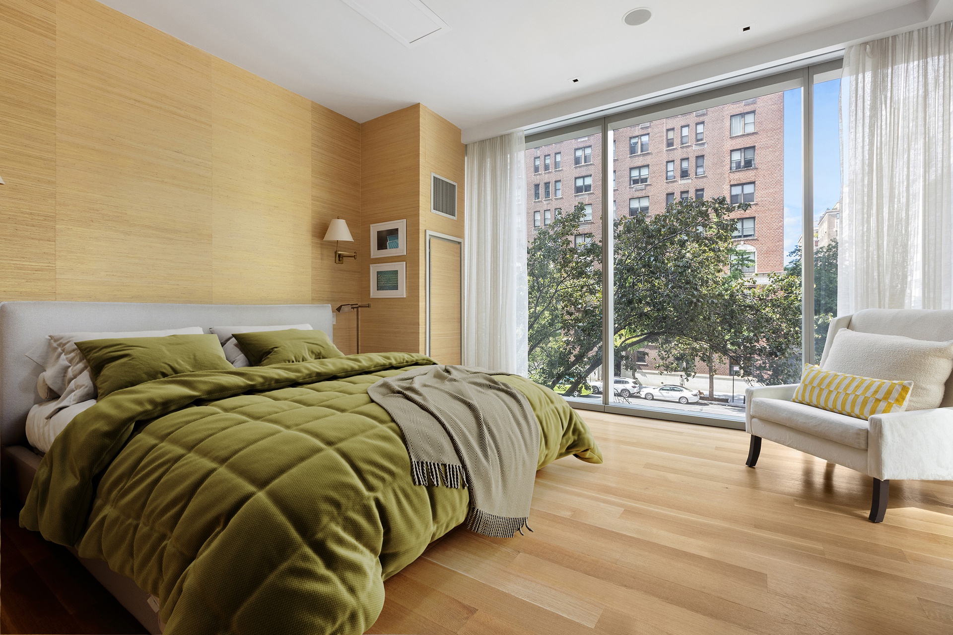 1055 Park Avenue, Unit 1 Manhattan, NY 10028 - Photo 10 of 19 a bed sitting in a bedroom next to a large window