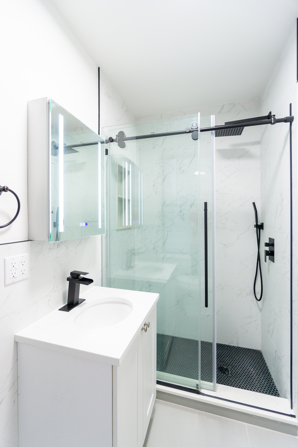 338 East 5th Street, Unit 5 Manhattan, NY 10003 - Photo 8 of 11 a bathroom with a shower and a sink