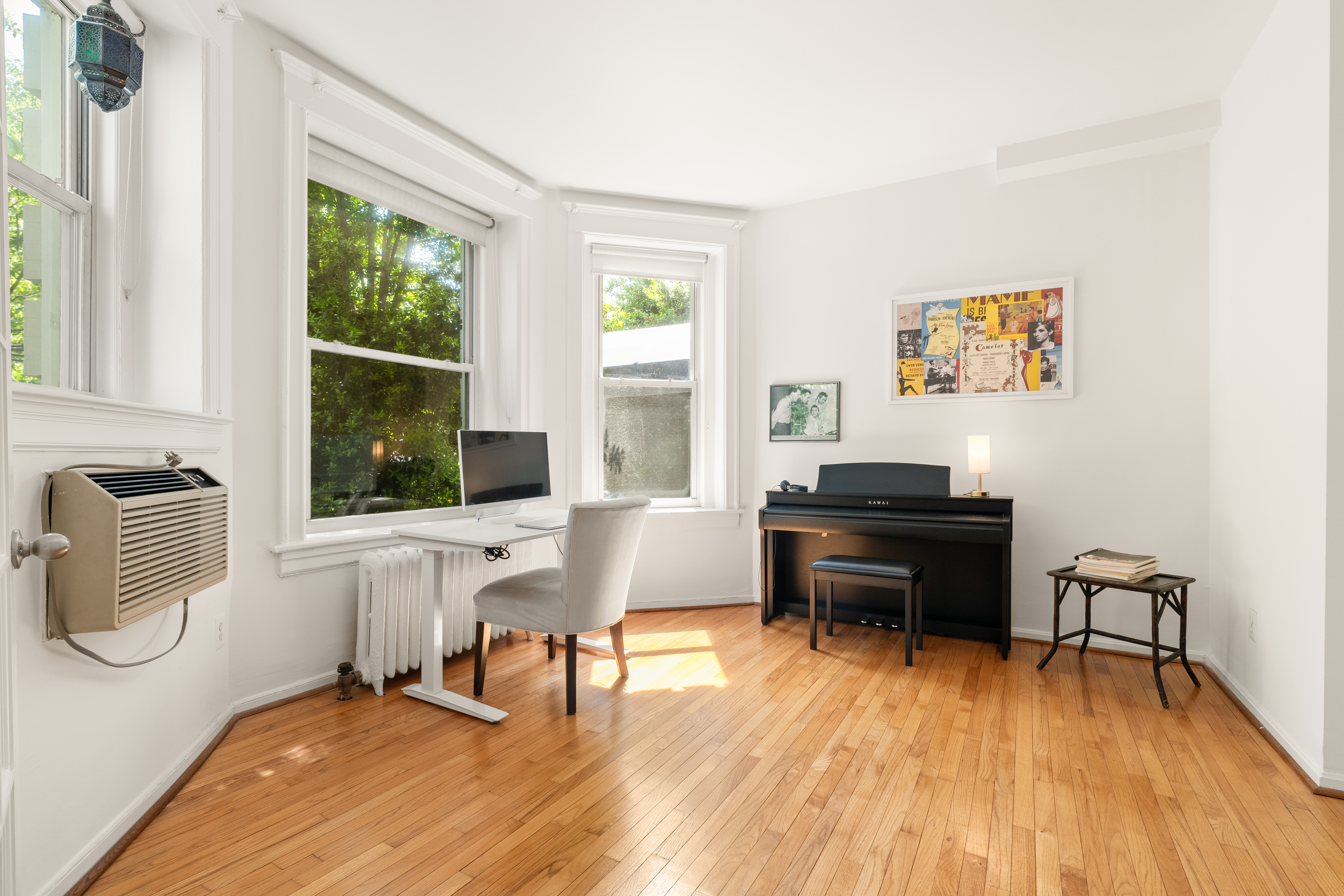 1855 Calvert Street Northwest, Unit 101 Washington, DC 20009 - Photo 9 of 14 a living room with furniture and a floor to ceiling window
