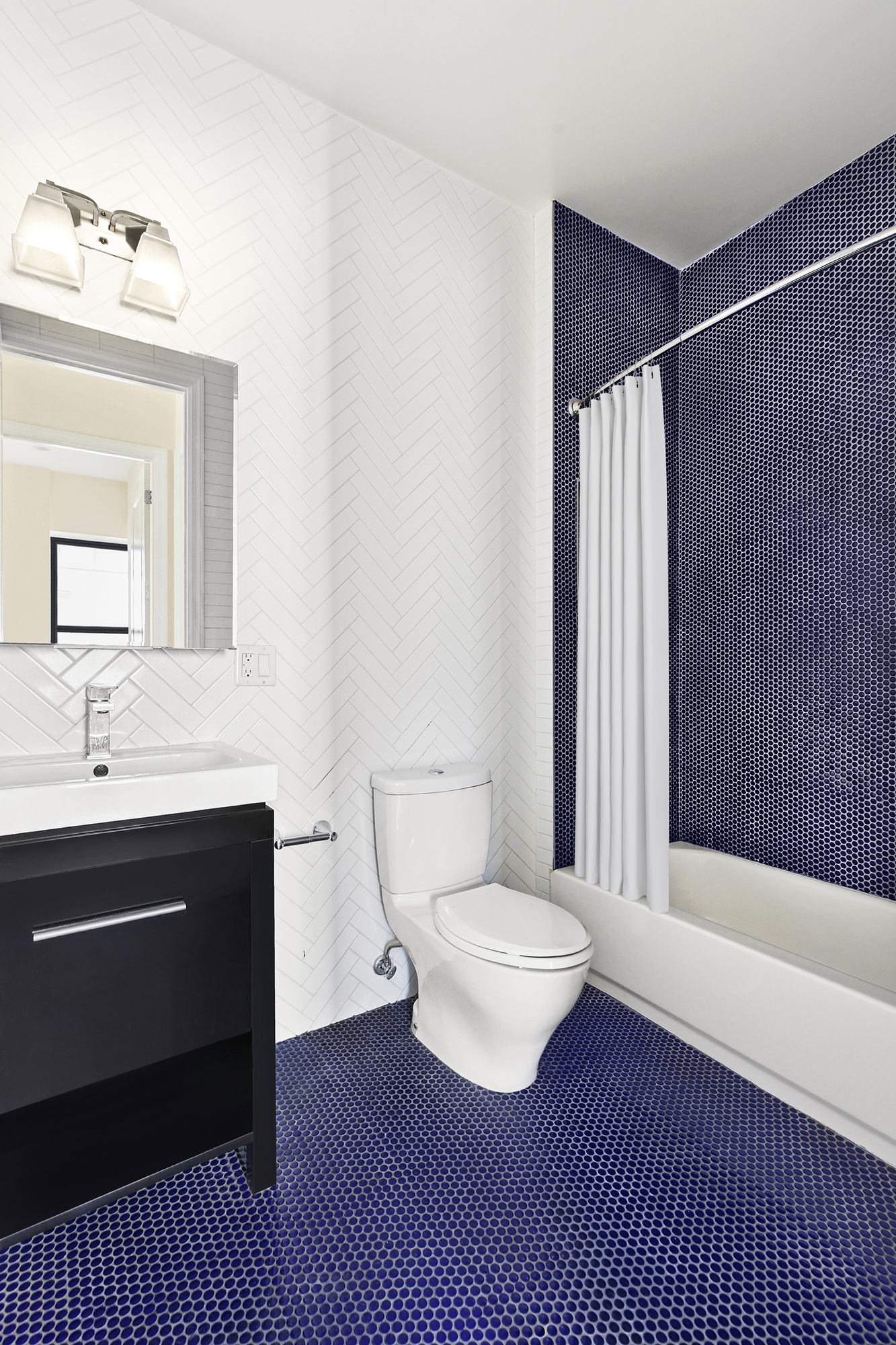 36 Linden Street, Unit 7D Brooklyn, NY 11221 - Photo 7 of 9 a bathroom with a sink and a mirror