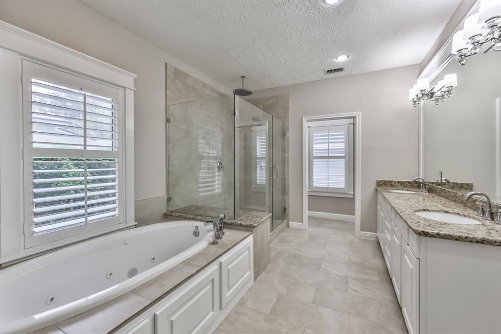 1120 Winston Street Houston, TX 77009 - Photo 20 of 29 a bathroom with a granite countertop tub sink and mirror