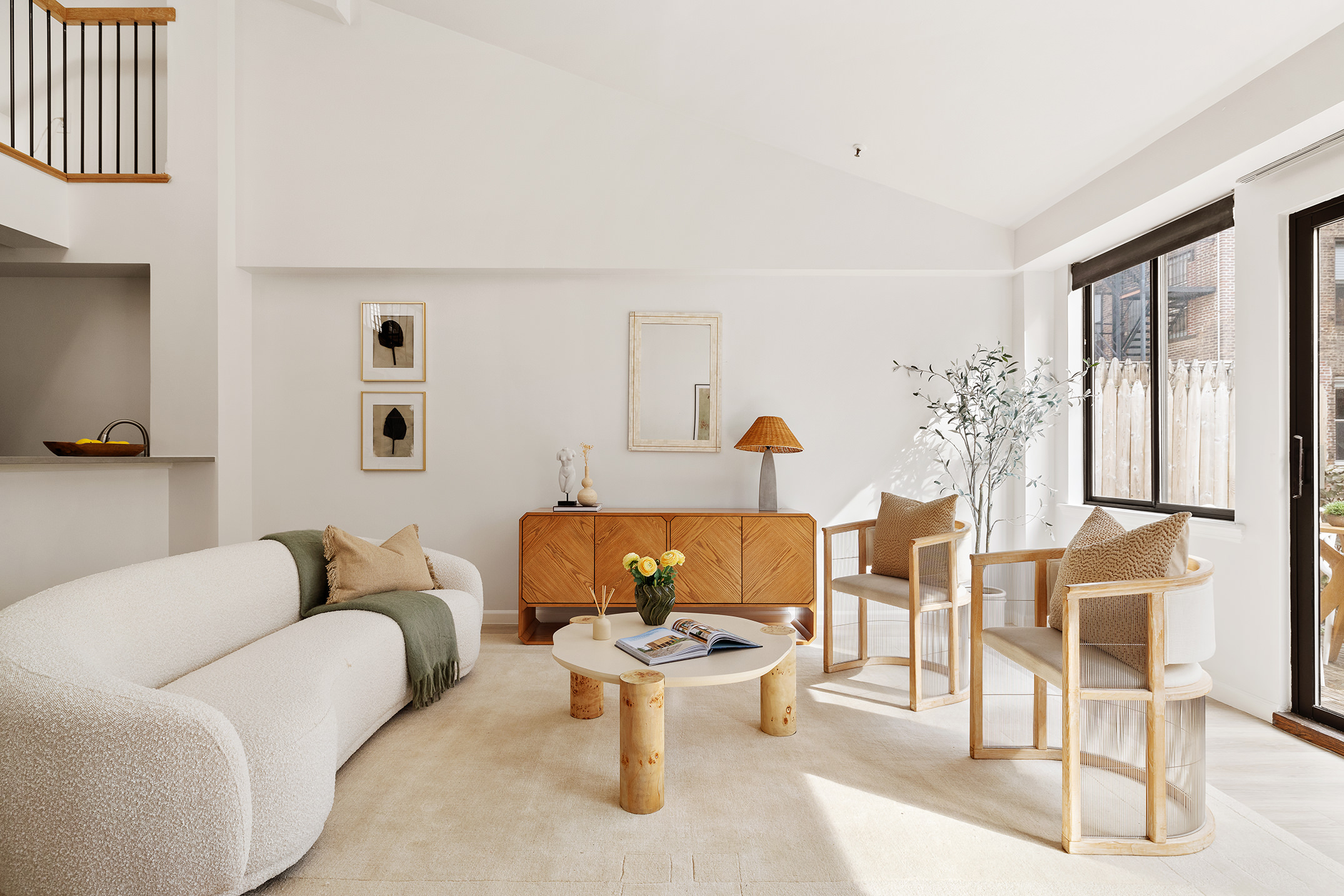 136-140 West 23rd Street, Unit PHD Manhattan, NY 10011 - Photo 4 of 15 a living room with furniture and a large window