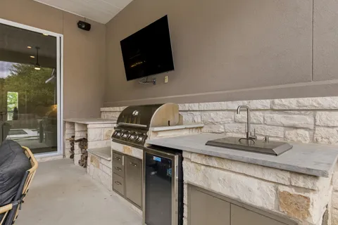 a view of a backyard with a patio