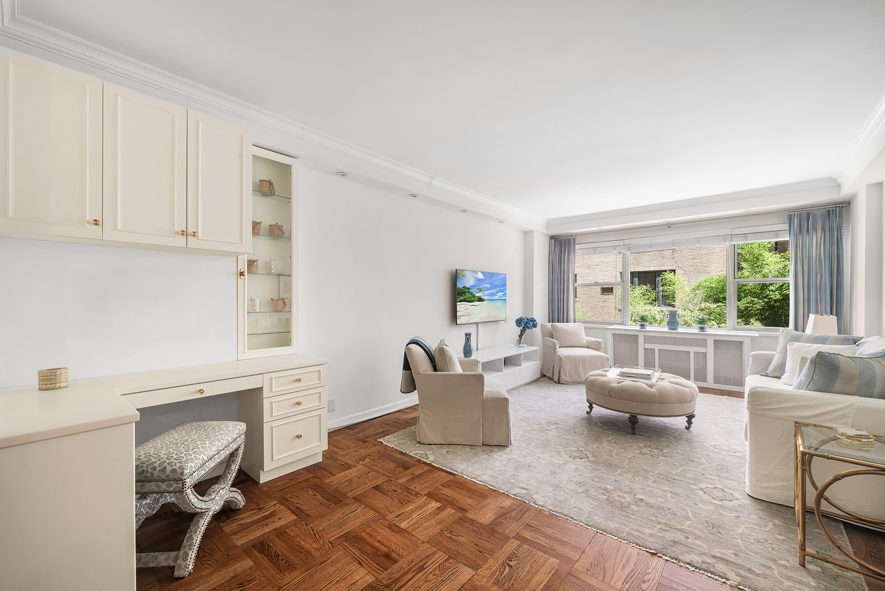 311 East 71st Street, Unit 2B Manhattan, NY 10021 - Photo 6 of 10 a living room with furniture and a window