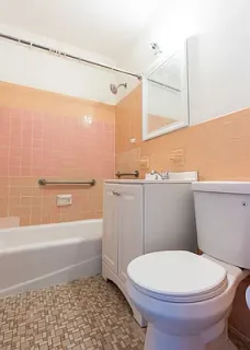 a bathroom with a toilet a sink and bathtub