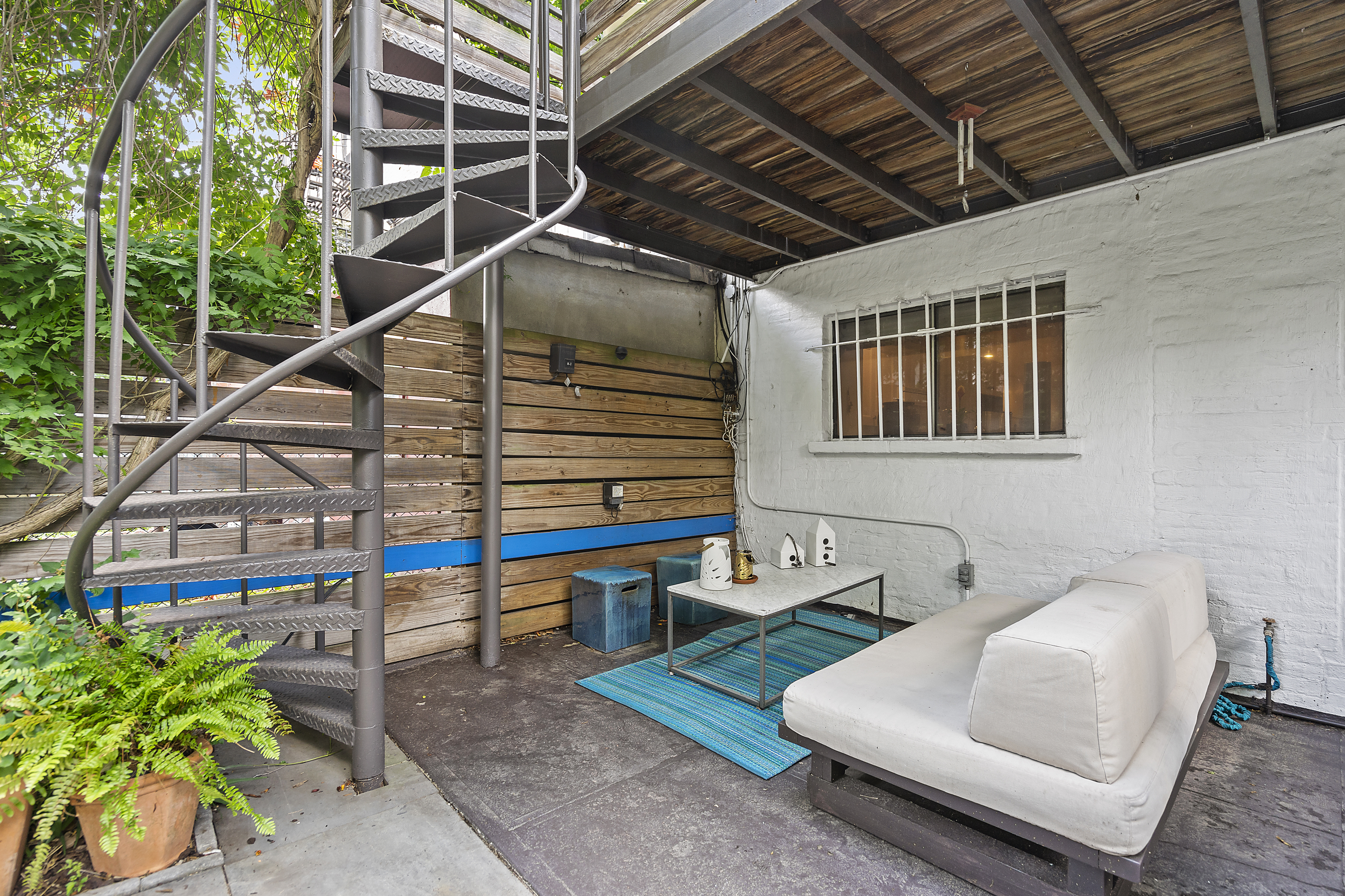 6 Virginia Place Brooklyn, NY 11213 - Photo 19 of 26 a balcony with furniture and a potted plant
