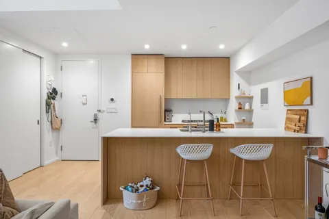 a kitchen with a table and chairs in it