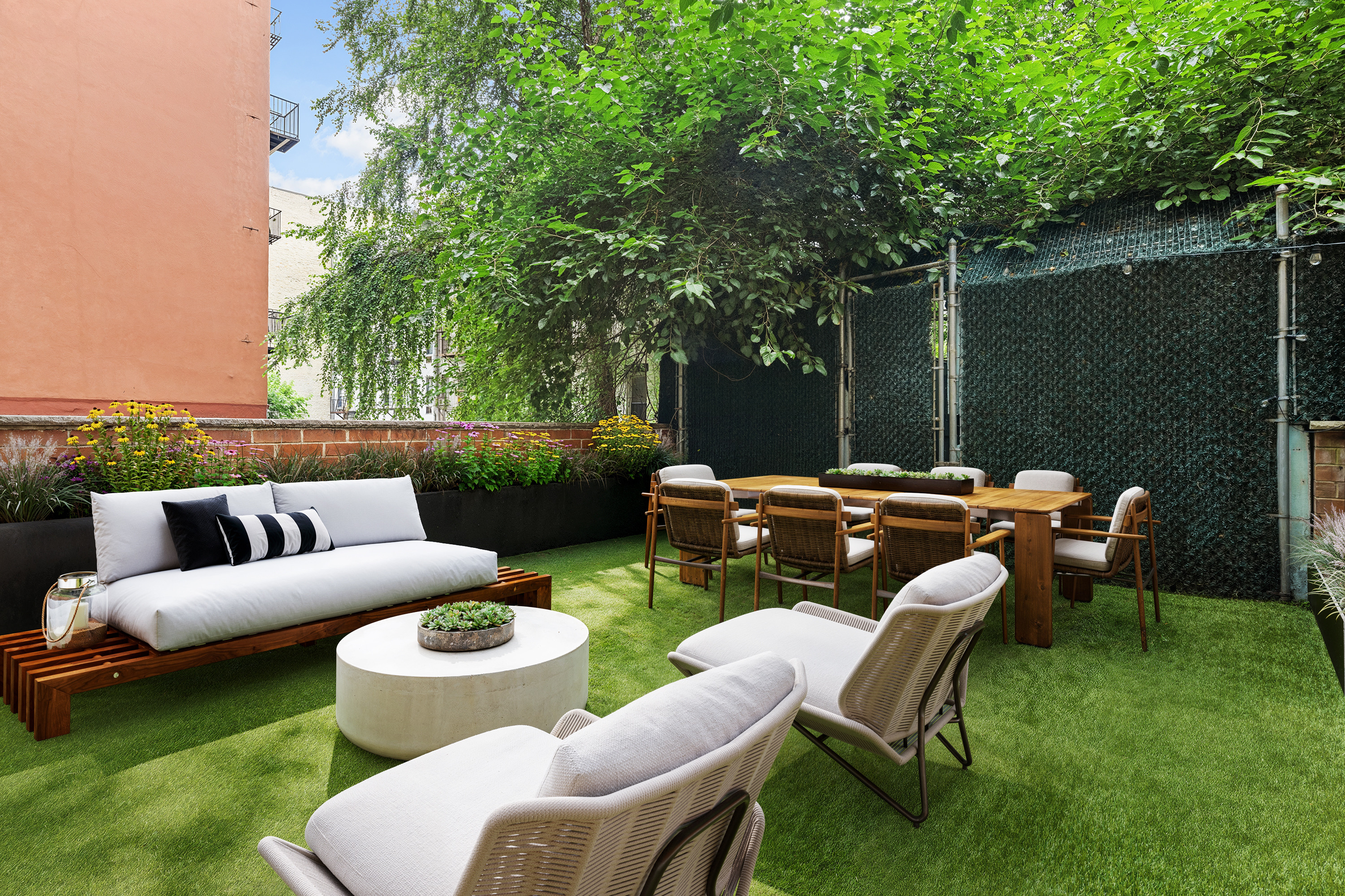 194 East 2nd Street, Unit 2C Manhattan, NY 10009 - Photo 3 of 17 a view of a patio with couches chairs and a table and chairs with garden view