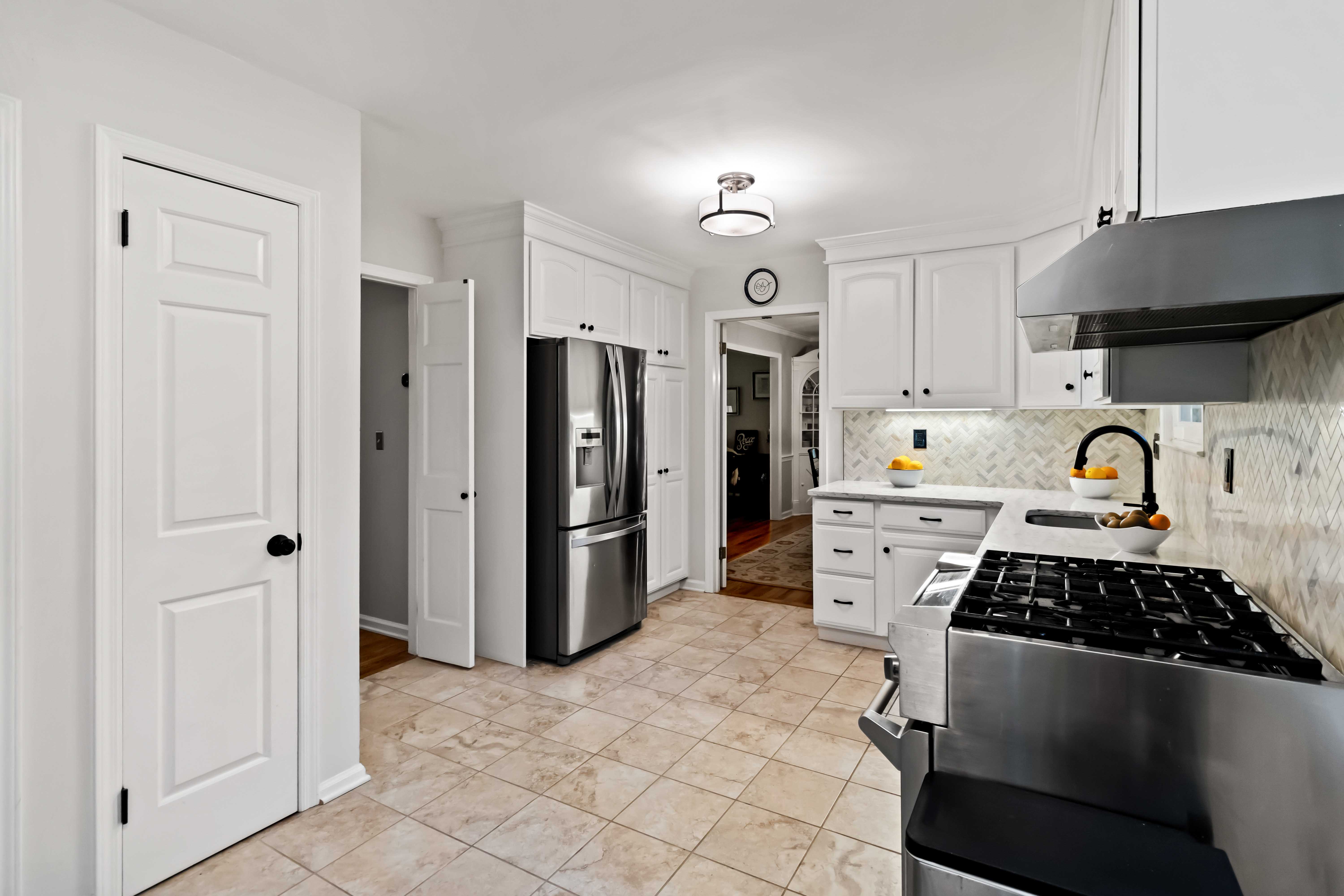 34 Colonial Drive Morristown, NJ 07960 - Photo 14 of 41 a kitchen with stainless steel appliances a stove a refrigerator and cabinets